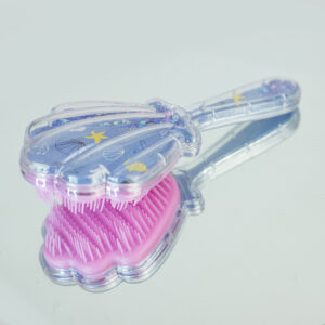 Medium sized shell shaped hair brush with moveable glitter